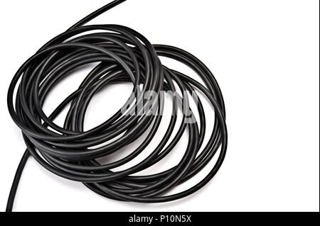Black electric cable on white background. Stock Photo
