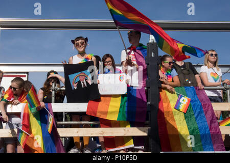 Warsaw, Poland - June 9, 2018: Participants of large Equality Parade - LGBT community pride parade in Warsaw city. Placard with Putin Stock Photo