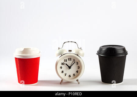 Coffee time concept - two disposable coffee cups and retro alarm clock on white background with copy space Stock Photo