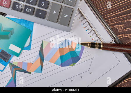 Financial accounting concept. Calculator, clip board, credit cards and pen. Stock Photo