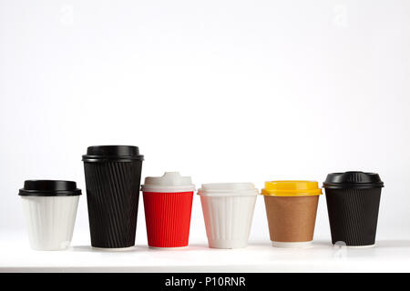 Six various recycled coffee cups on white background with copy space Stock Photo