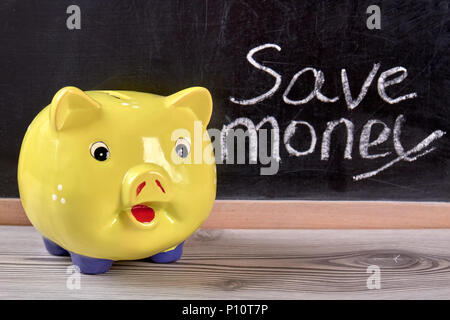 Piggy moneybox, close up. Save money concept in black background. Stock Photo