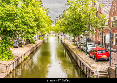 Canal street with its traditional houses and bridges in a neighborhood of la vila de edam. netherlands Stock Photo