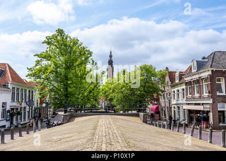 view of church dome over a covered canal in the center of the edam vila. netherlands Stock Photo