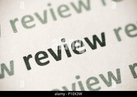 word review printed on white pap er macro Stock Photo