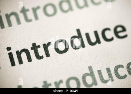 word introduce  printed on white paper macro Stock Photo