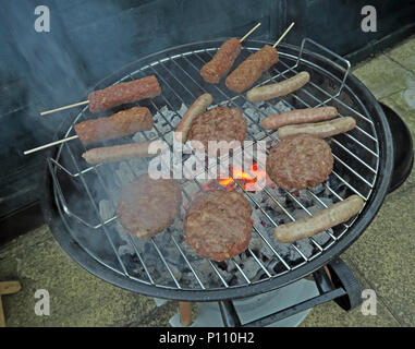 Well cooked BBQ meat on summer garden barbecue Stock Photo