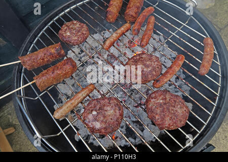 Well cooked BBQ meat on summer garden barbecue Stock Photo