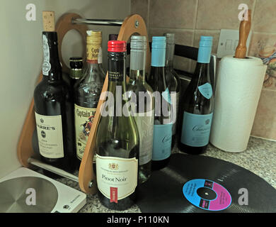 Epidemic of drinking too much alcohol at home, wine beer, rum,port Stock Photo