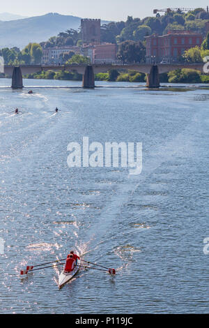 Sculling boat on the river Arno in Florence, Italy Stock Photo