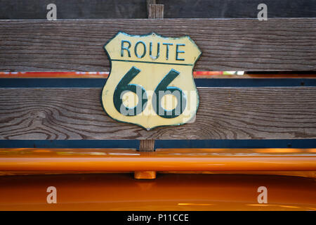 vintage route 66 road sign  on wooden planks of pickup truck Stock Photo
