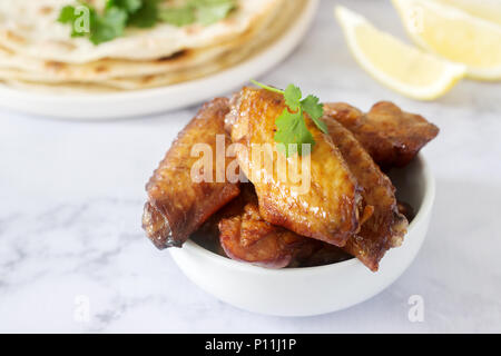 Homemade delicious food of tortillas, salsa and fried wings. Selective focus. Stock Photo