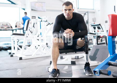 Disabled man in gym Stock Photo