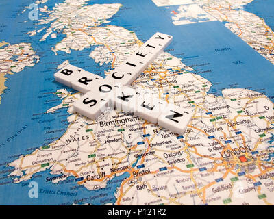 representation of broken society, a perceived or apparent general decline in moral values, with United Kingdom map background Stock Photo