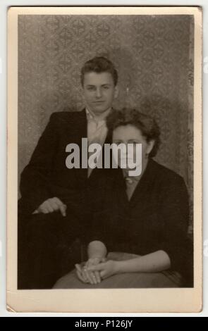 THE CZECHOSLOVAK SOCIALIST REPUBLIC - CIRCA 1960s: A vintage photo shows mother with adolescent son. Stock Photo