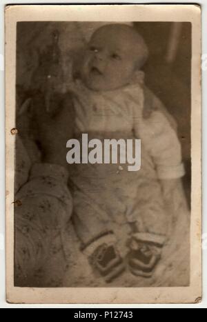 THE CZECHOSLOVAK SOCIALIST REPUBLIC - CIRCA 1960s: Vintage photo shows baby boy. Stock Photo