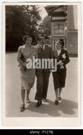THE CZECHOSLOVAK  REPUBLIC - CIRCA 1930s: Retro photo shows man and two women Stock Photo