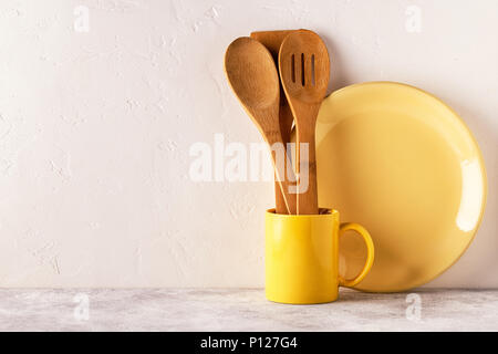 Crockery and cutlery on a light table with copy space. Stock Photo