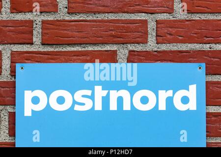 Fredericia, Denmark - April 21, 2018: Postnord logo on a wall Stock Photo