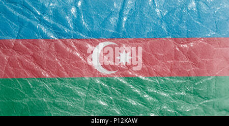 Azerbaijan flag on leather texture background close up . Stock Photo