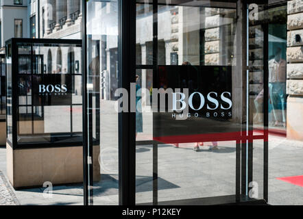 Berlin, Germany - june 09, 2018: The logo / brand name of HUGO BOSS on shop facade exterior in Berlin, Germany Stock Photo