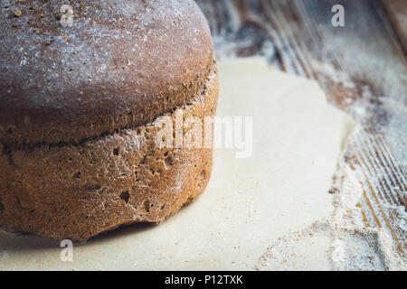 freshly baked bread on dark gray kitchen table Stock Photo