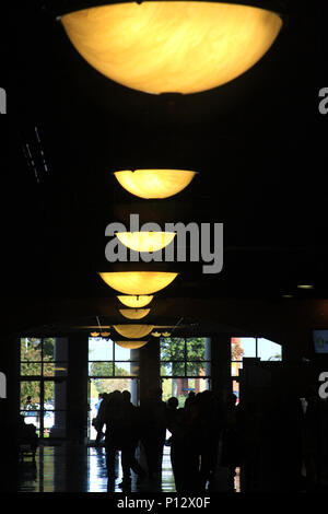 Row of light fixtures in large hallway Stock Photo