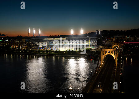 Pittsburg, PA, USA - June 6, 2-18 :  Pittsburg Pirates PNC Park illuminated at night with traffic on Roberto Clemente Bridge. Stock Photo