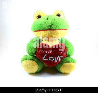 Cute stuffed yellow and green frog toy with heart, isolated Stock