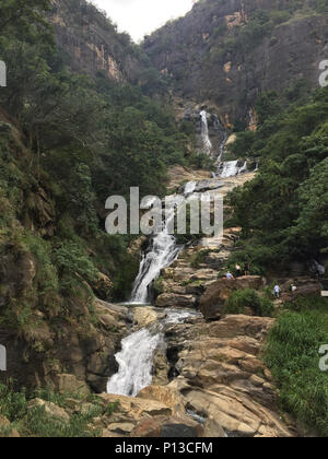 Ravana Falls or Ravana Ella waterfalls is a popular sightseeing attraction near Ella Sri Lanka. Stock Photo