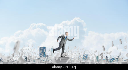 Precise businessman in suit running with phone Stock Photo - Alamy