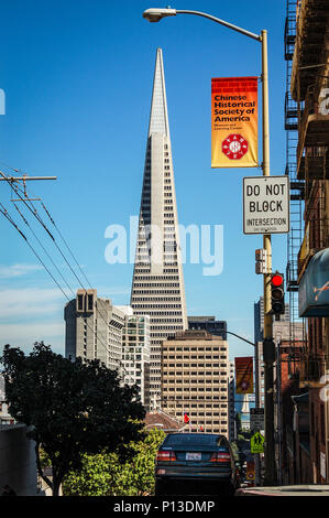 View of the iconic Transamerica Pyramic in the financial district of San Francisco.  Taken from a street at a higher elevation, against a blue sky. Stock Photo