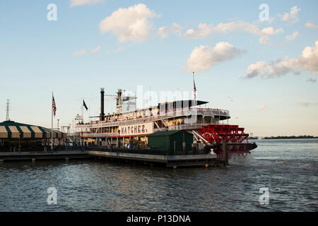 The paddlewheeler Natchez docked at sunset along the Mississippi River in New Orleans, Louisiana. Stock Photo