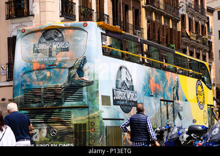 Open top double decker tourist sightseeing bus with Jurassic World movie advertising. Madrid, Spain. May 2018 Stock Photo