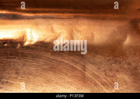 Scratched texture copper plating background close-up Stock Photo