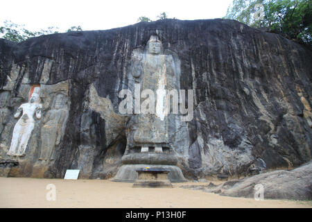 Buduruwagala is an ancient buddhist temple in Sri Lanka. The largest of the standing Buddha statues is 51 feet (16 m) from head to toe Stock Photo