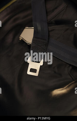 Seat belt on seat shot in airplane.Dark tone and Selective focus Stock Photo