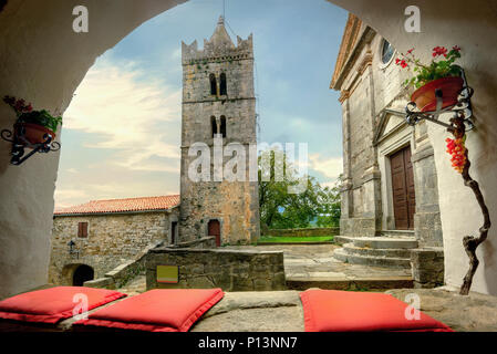 Beautiful view of ancient tower and church in small historic Hum town. Istria, Croatia Stock Photo