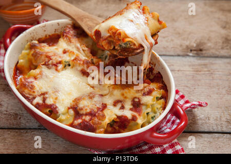 italian lasagna rolls made with tomatoes spinach and ricotta cheese Stock Photo