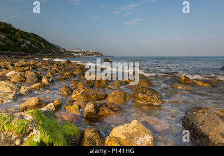 a beautiful and atmospheric seascape on the beach or coast at ventnor on the isle of wight. low tide and rocky beach at steephill cove isle of wight. Stock Photo