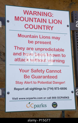 Mountain Lion warning sign at a trailhead in Orange County California USA Stock Photo