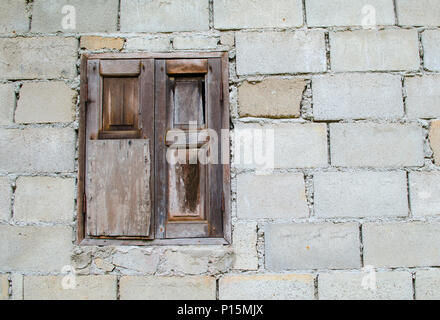 background of old brick wall with vintage window Stock Photo