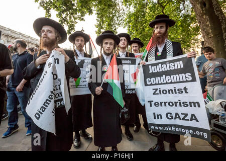 London, UK. 10th June, 2018. Neturei Karta, a religious group of Haredi Jews who oppose secular Zionism and support Palestine, join Al Quds Day march through central London. Credit: Guy Corbishley/Alamy Live News Stock Photo