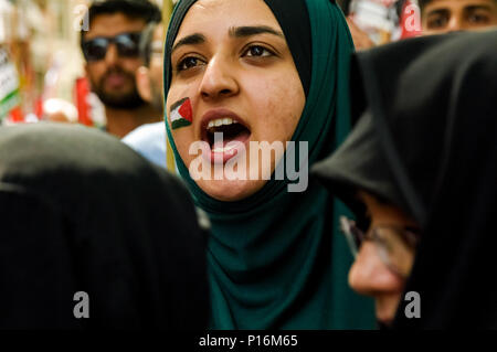 June 10, 2018 - London, UK. 10th June 2018. A woman with a Palestinian flag painted on one cheek  at the rally front of the Saudi Arabian embassy for a rally in support of the oppressed people of Palestine and others around the world. The event, organised by the Justice for Palestine Committee, is supported by the Islamic Human Rights Commission and a wide range of pro-Palestinian organisations, and was opposed by the Zionist Federation and some right wing hooligans, who were stopped from attacking the peaceful event by a large police presence in the area. Celebrated in many countries, the day Stock Photo