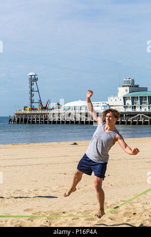 Bournemouth, Dorset, UK. 11th June 2018. UK weather: lovely very warm sunny start to the day at Bournemouth beaches as temperatures rise and visitors head to the seaside to enjoy the sunshine.  Balancing act! Credit: Carolyn Jenkins/Alamy Live News Stock Photo