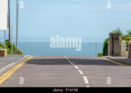 Bournemouth, UK. 11th June 2018. Cliff front road leads to the sea in Bournemouth. Credit: Thomas Faull/Alamy Live News Stock Photo
