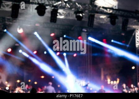 abstract blurred photo of spotlights and musicians during outdoor concert  Stock Photo