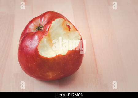Bitten apple on a wood Stock Photo