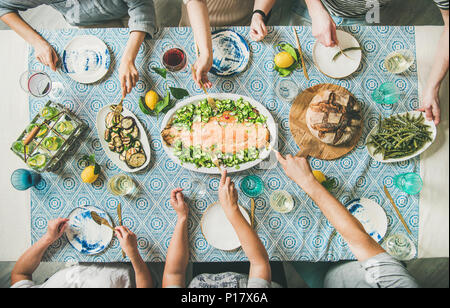 Family or friends having seafood summer dinner Stock Photo