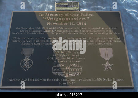 The plaque that sits atop the 1st Cavalry Division Resolute Support Sustainment Brigade Memorial which was dedicated May 7 at Bagram Airfield (BAF), Afghanistan. Staff Sgt. John W. Perry, Pfc. Tyler R. Iubelt, Col. (Ret.) Jarrold M. Reeves and Dr. Peter L. Provost were killed by a suicide bomber at BAF on Nov. 12, 2016. Sgt. 1st Class Allan E. Brown died of his wounds Dec. 6, 2016. Stock Photo